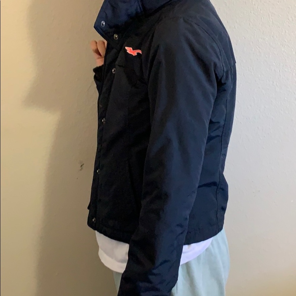 Jacket with zipper, buttons and cap